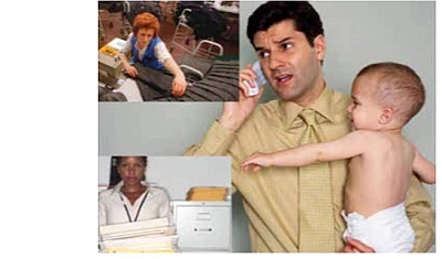 man on the phone holding a baby